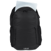 a black backpack with a white paper in it