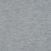 a grey fabric with a black spot