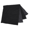 a black folded napkin on a white background