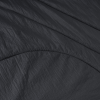 a black fabric with a curved line