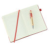 a red and white notebook with a red pencil on it