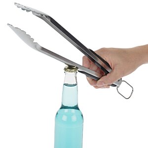 Additional Image 1 - a person holding tongs over a bottle