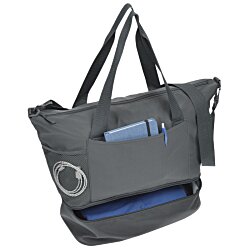 a grey tote bag with a blue and black strap