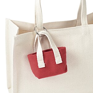 a white bag with a red square on it