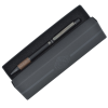 a black pencil case with a brown pen in it