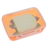 a small plastic container with a white object on it