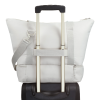 a white pillow on a black suitcase