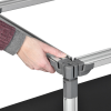 a hand holding a grey object