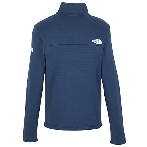 Additional Image 2 - a blue jacket with a white logo