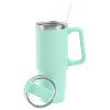 a green mug with a straw