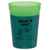 a green plastic cup with black text