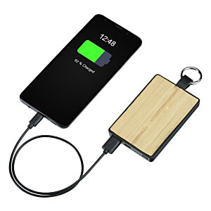 Additional Image 2 - a black and green device with a cord