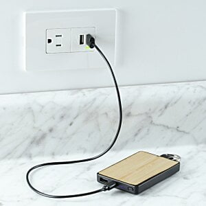 Additional Image 4 - a phone plugged into a wall outlet