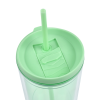 a green straw in a cup