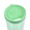 a green lid on a plastic cup