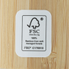 Additional Image 9 - a white label on a wood surface