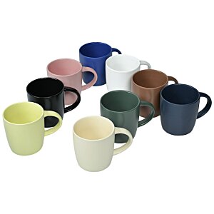 a group of different colored mugs