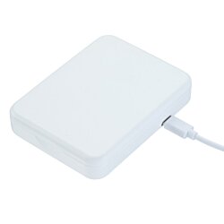 a white rectangular object with a cord