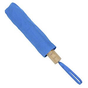 Additional Image 2 - a blue toothbrush with a wooden handle