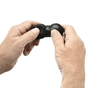 Additional Image 3 - a person holding a black controller