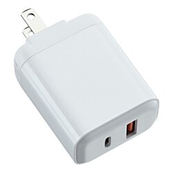 a white charger with two ports