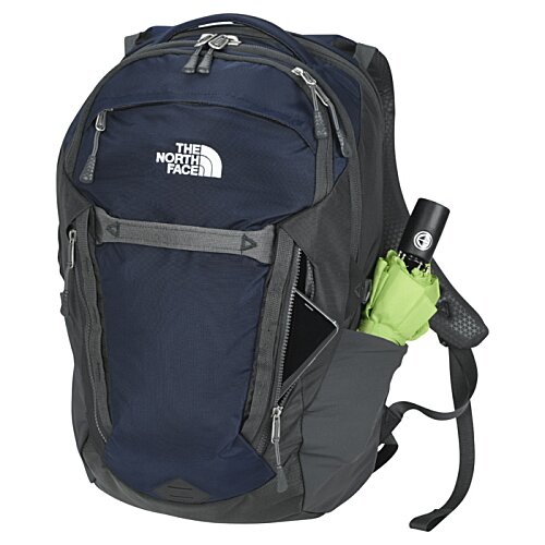 Additional Image 2 - a blue backpack with a green bottle