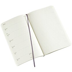 a white notebook with a purple pen