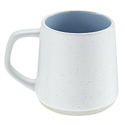 a white mug with a handle