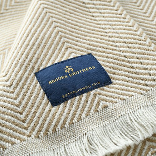 Additional Image 1 - a blue and gold label on a white blanket