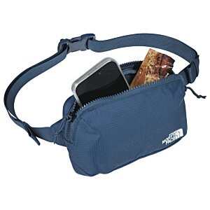 Additional Image 3 - a blue pack with a black object in it