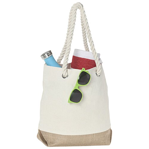Additional Image 1 - a white bag with sunglasses and a bottle