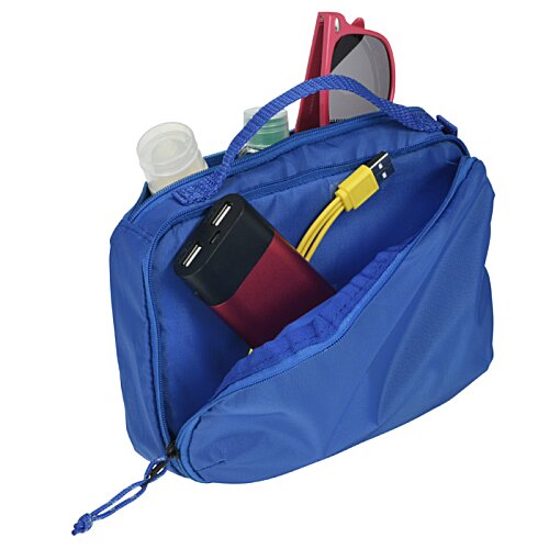Additional Image 3 - a blue bag with a cell phone and other items inside