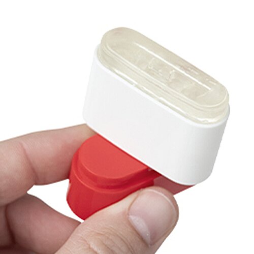Additional Image 2 - a hand holding a red and white rubber stamp