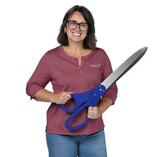 Additional Image 1 - a woman holding a large blue scissors