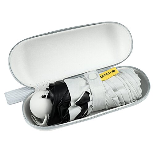 Additional Image 1 - a white oval container with a black and white object inside
