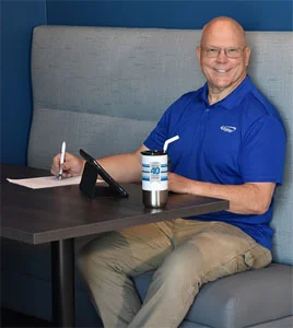 4imprint employee with logoed anniversary gifts