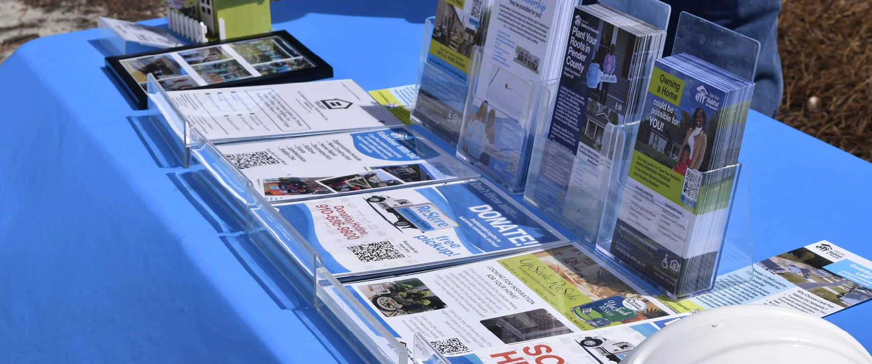 table with a display of flyers and brochures