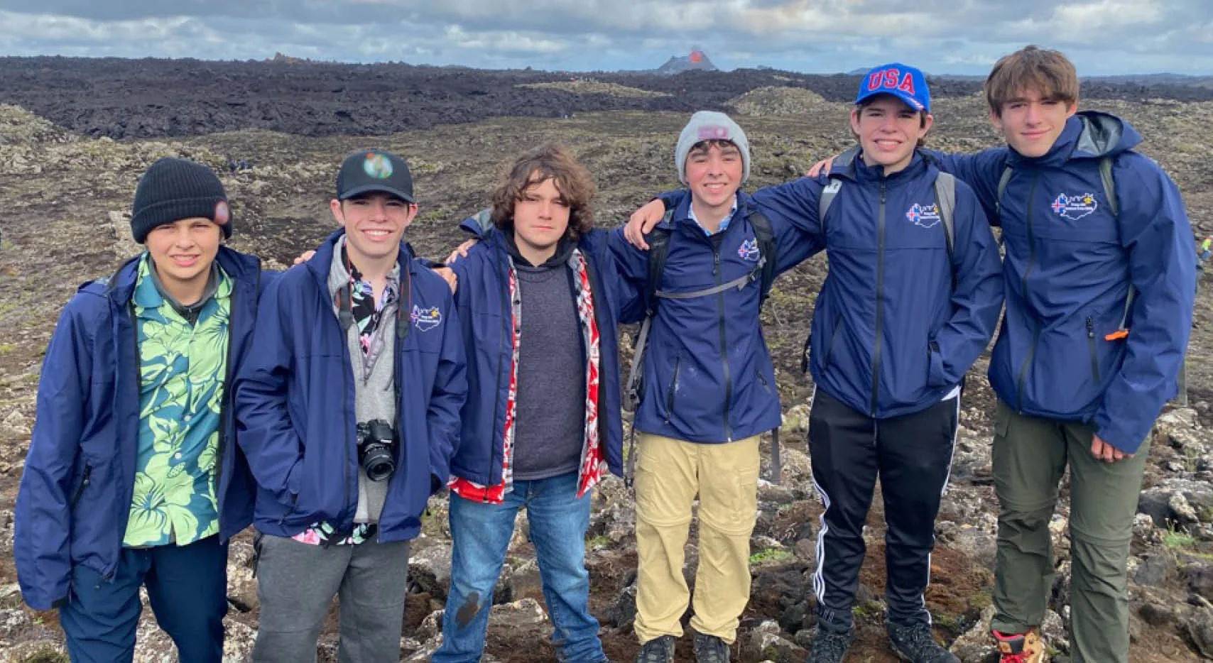 group of people wearing branded jackets