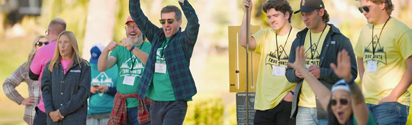 A group of people holding up their hands