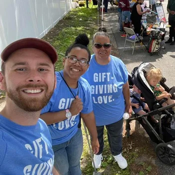 Group of people at a charity walk with branded t-shirts
