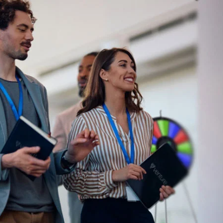 Trade show attendees waiting in line to play a game.