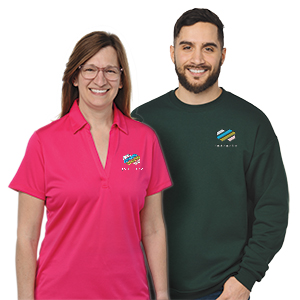 Employees wearing a polo and a long sleeve shirt