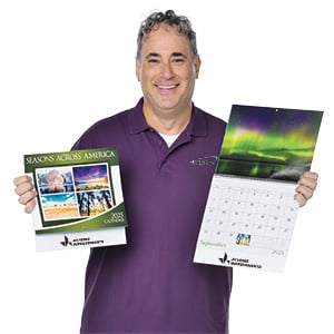 Employee holding a 2024 calendar
