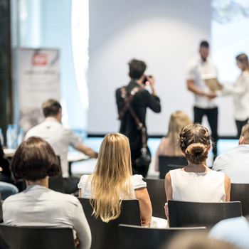 A group of people attending a presentation