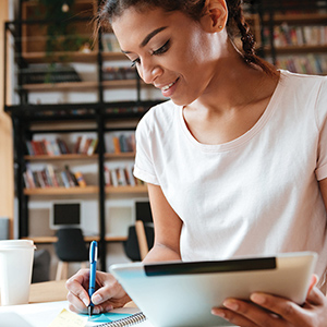 Woman writing in a notebook
