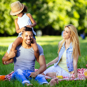 Couple at a picnic with a child