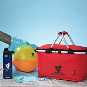 Promotional products that include a picnic basket, beachball, water bottle and towel