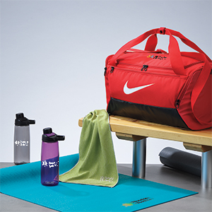 Workout items that include towels, bottles and yoga mats