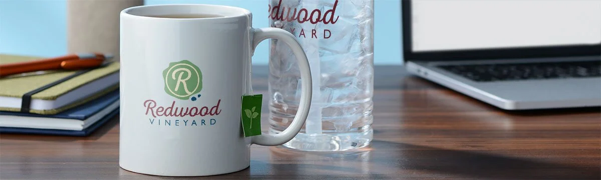 Coffee cup with a tea bag sitting on a desk