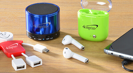 Technology products that include wireless ear buds, wireless speaker and USB charger